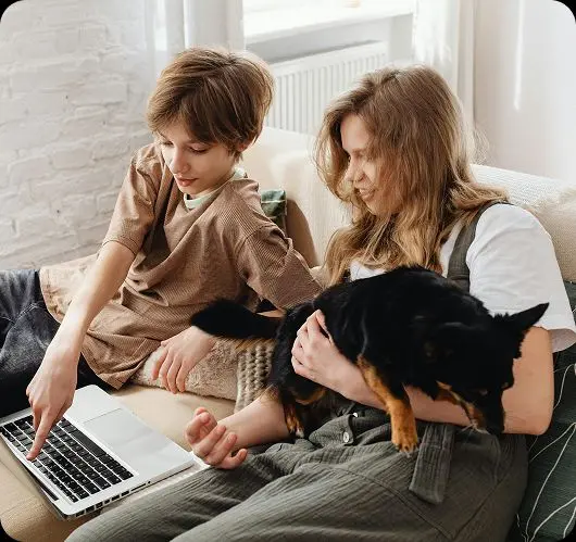 A parent and child reviewing schoolwork together, representing families who choose Teneo Online School for a smarter, more flexible education
